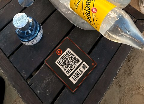 Ordofy QR at the table at Paradise Beach